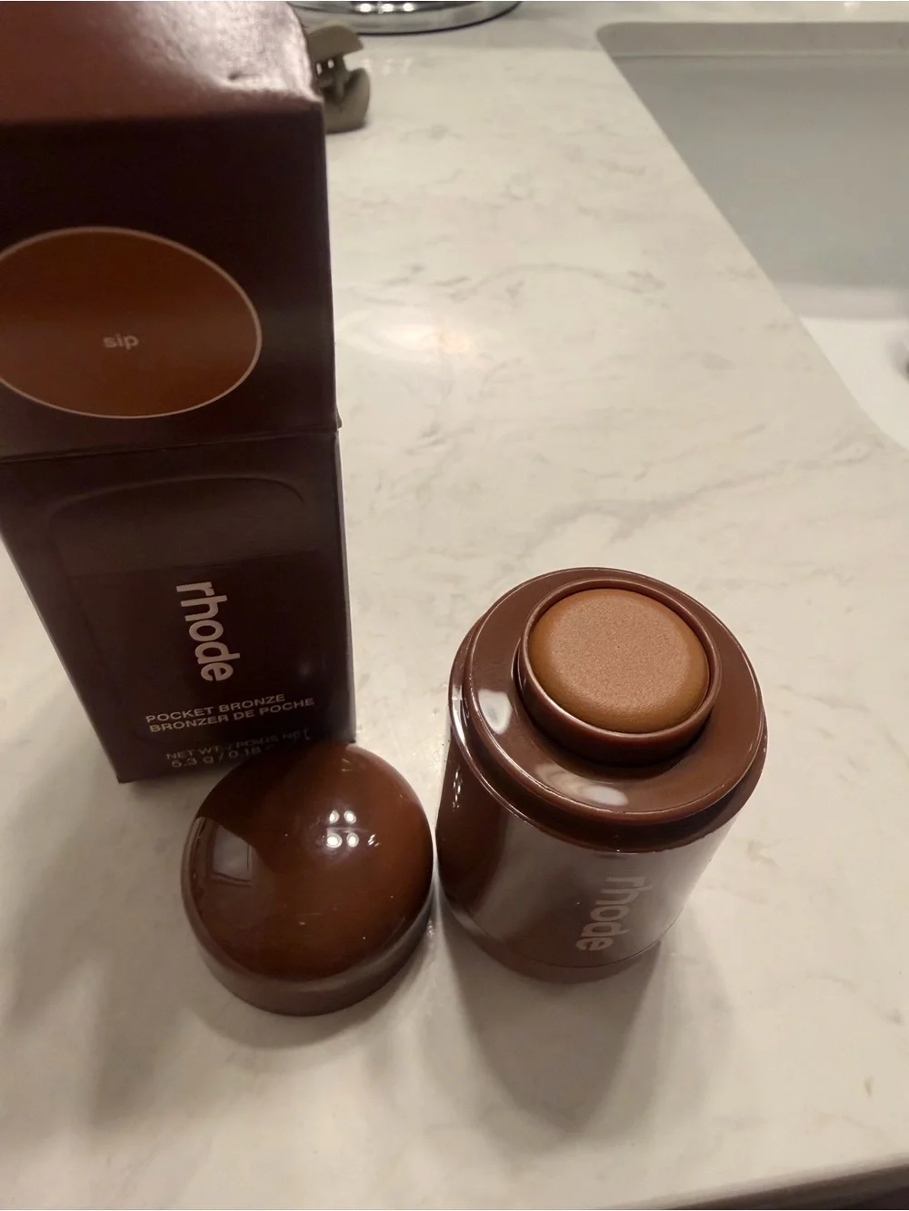 RHODE Pocket Bronze Compact in Deep Brown Packaging
